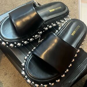 Women’s size 9 black slides with silver stud details